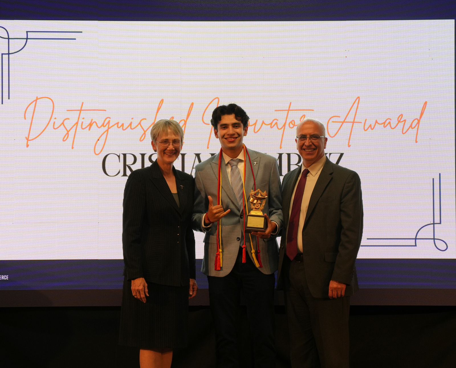 Cristian Ambriz receiving the Distinguished Innovator Award